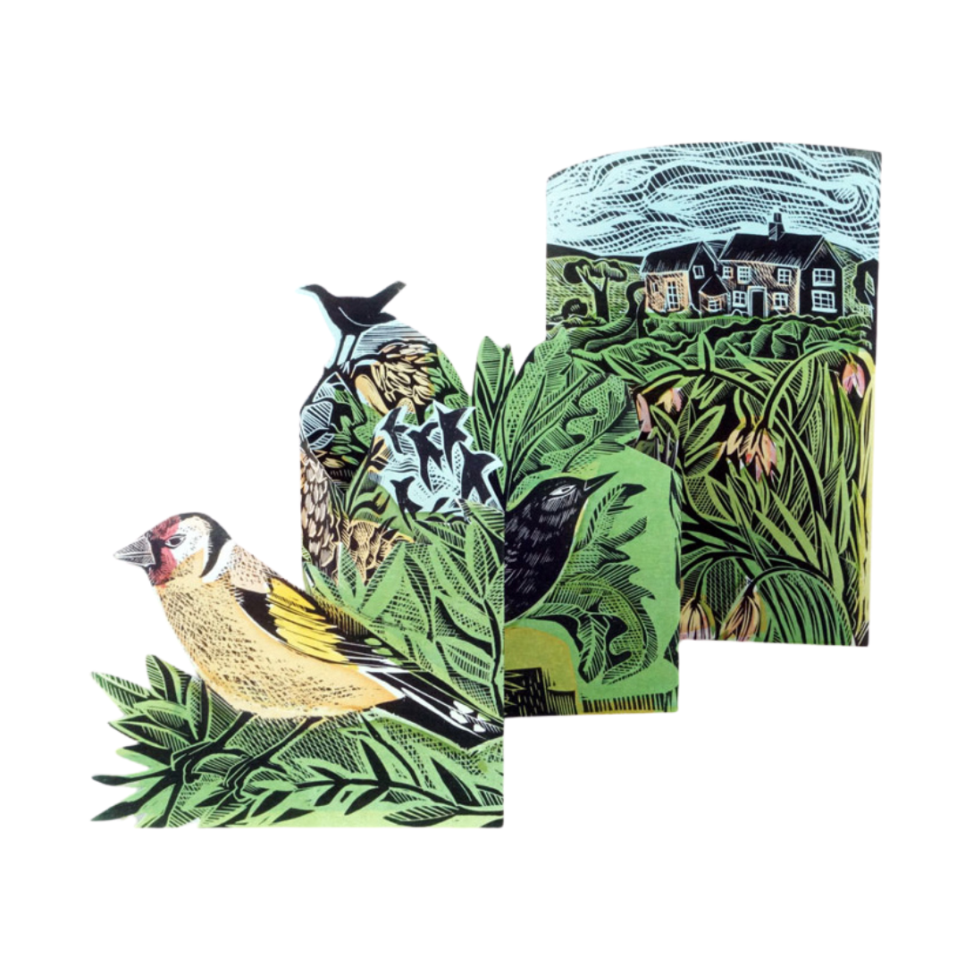 Linocut print depicting a goldfinch and other birds amidst foliage, with a background scene of a house and landscape.