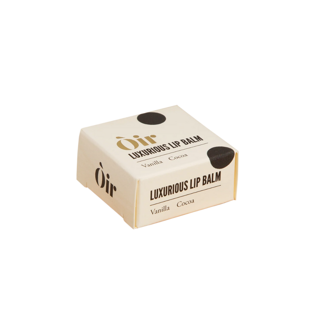 Box of Òir luxurious lip balm on a white background
