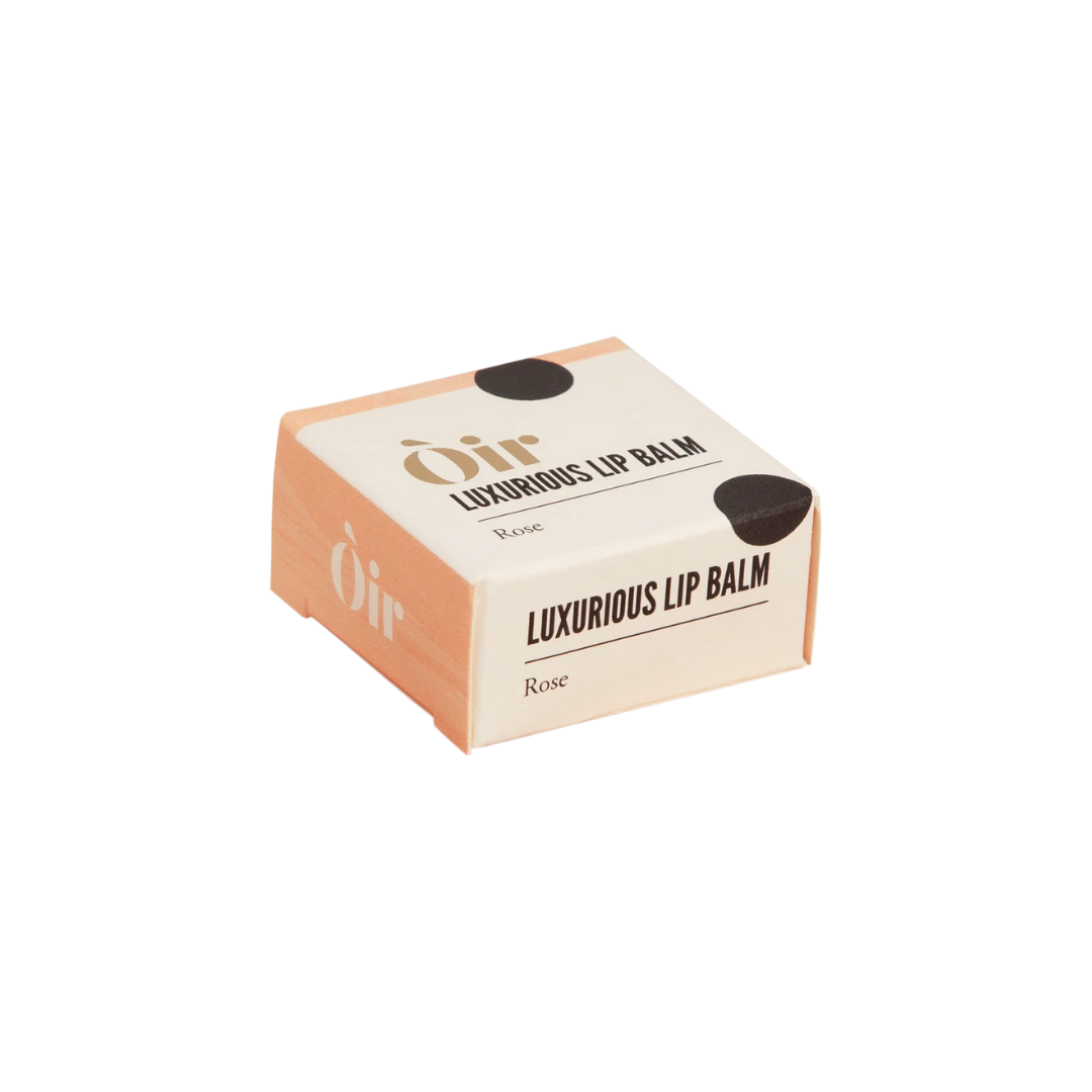 Box of Oir Luxurious Lip Balm on a white background