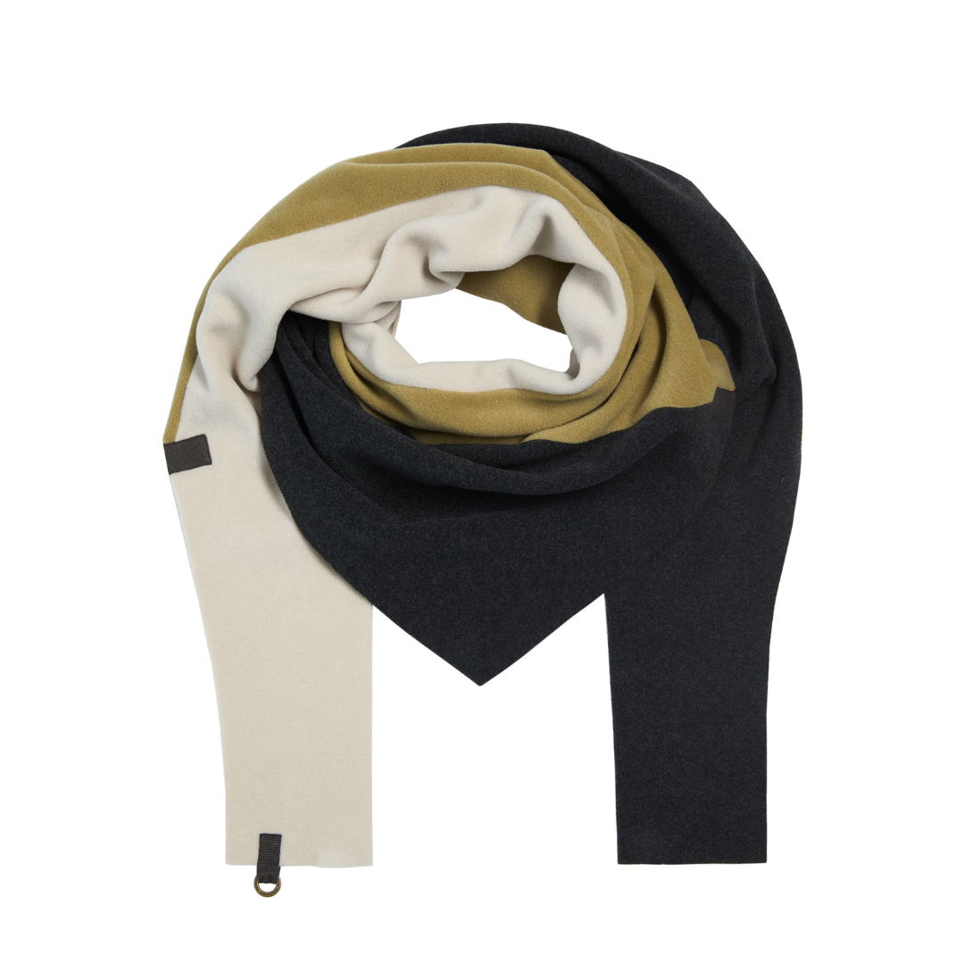 Multicolored scarf with black, beige, and white sections on a white background