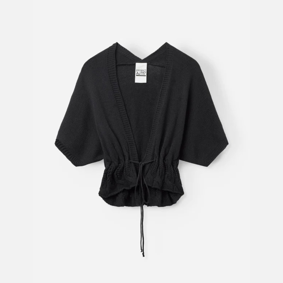 Black knit cardigan with drawstring on a white background
