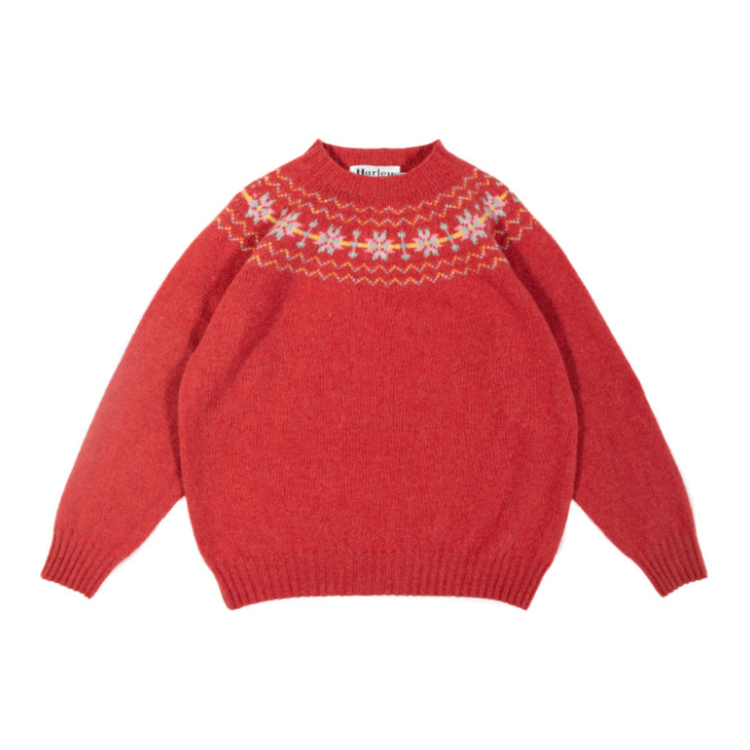 Red sweater with a patterned neckline on a white background