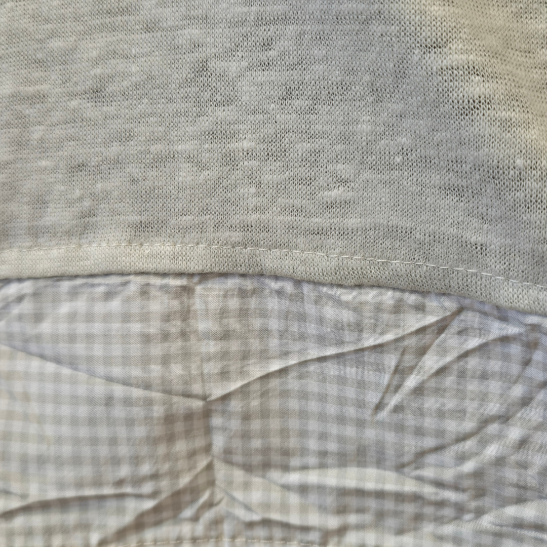 Close-up of a textured fabric with a checkered pattern