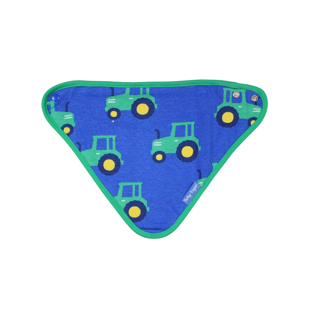 A triangular baby bib with a blue background printed with green tractors and yellow wheels, featuring a green border and metal snap closures.