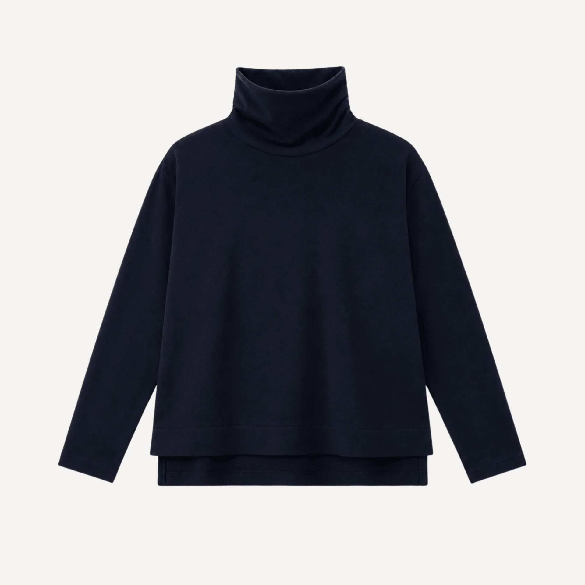 A dark navy blue long-sleeve turtleneck top with a relaxed, oversized fit and a subtle asymmetrical hem, shown against a light gray background.