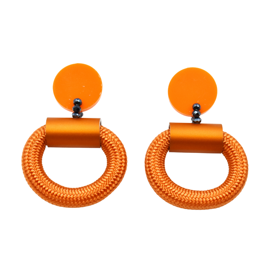 Pair of orange statement earrings.