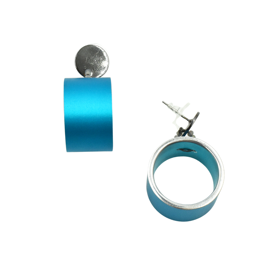 Pair of turquoise blue cylindrical hoop earrings with silver-toned accents.