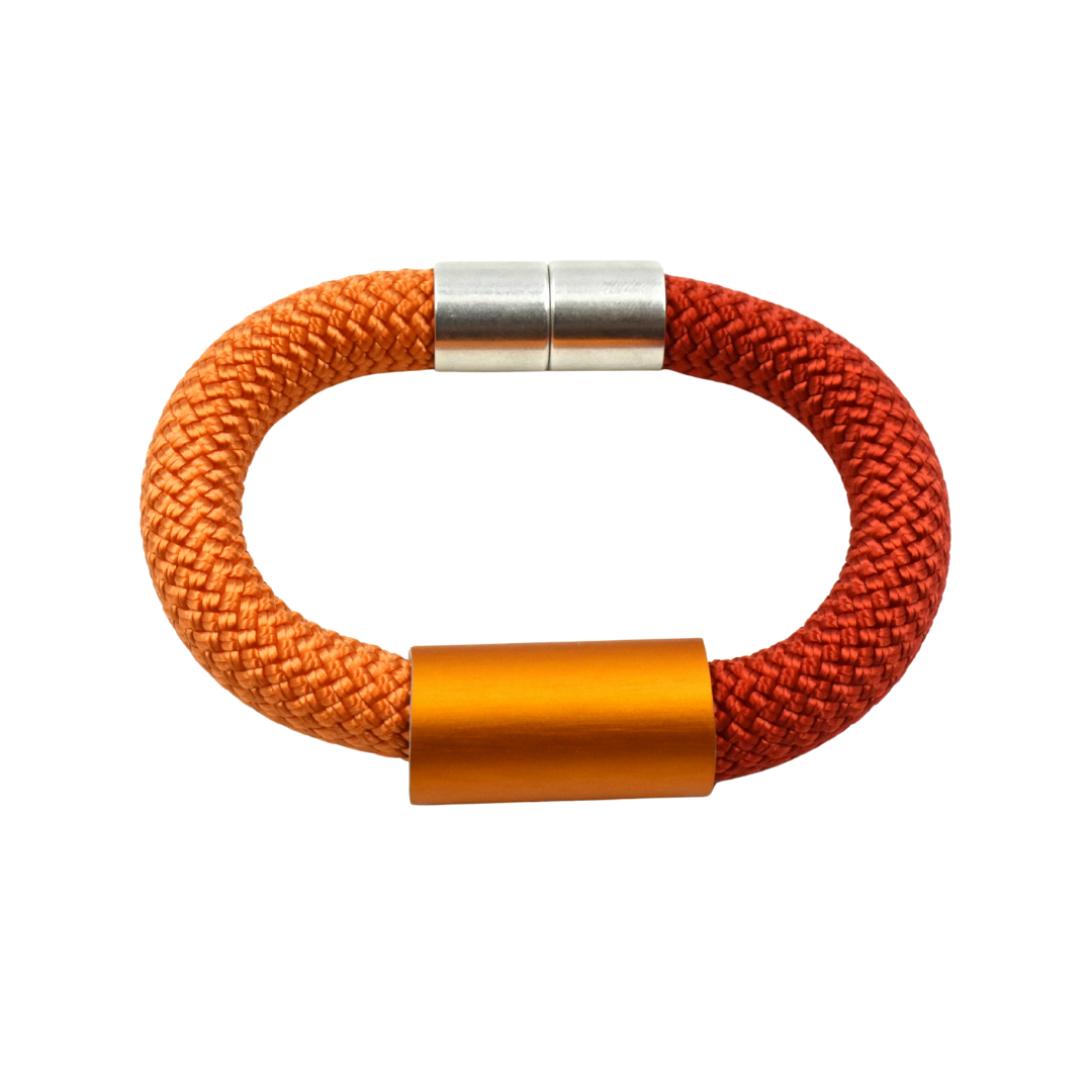 Orange and red braided rope bracelet with silver and orange metal accents.