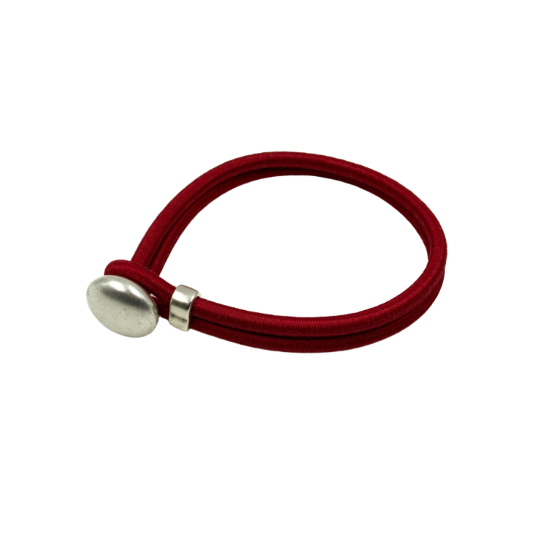 Red elastic bracelet with a silver button clasp.