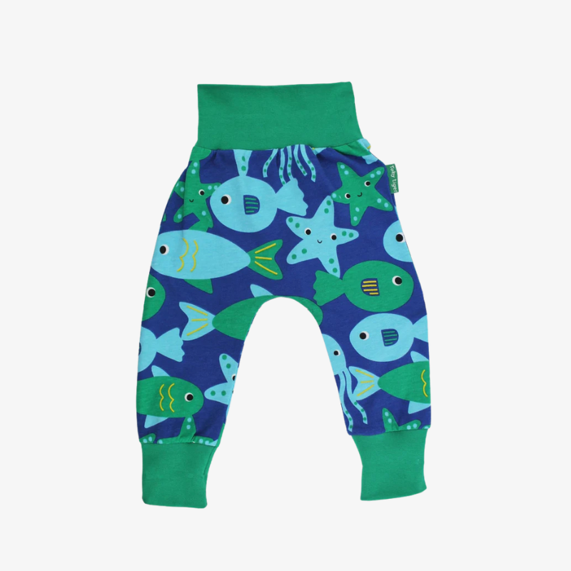 Children's pants with fish and starfish pattern on a white background