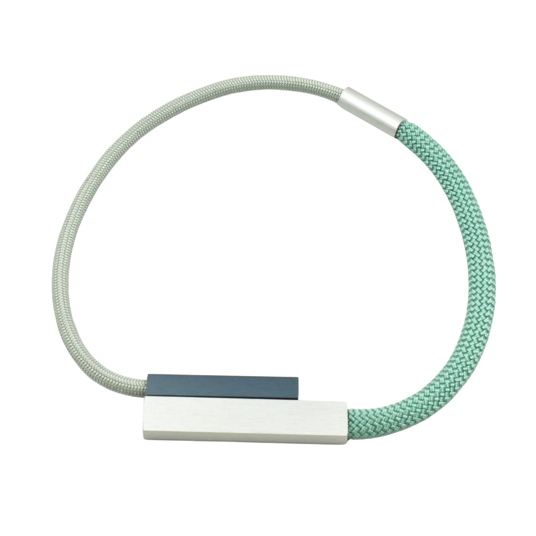 Silver and pale green rope necklace with a rectangular silver and dark gray accent.