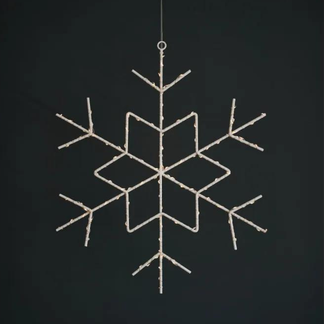 Large illuminated snowflake decoration with a metallic wire frame and warm white LED lights.