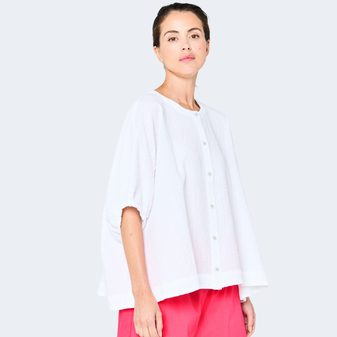 White textured cotton button-down shirt with balloon sleeves and a relaxed fit.