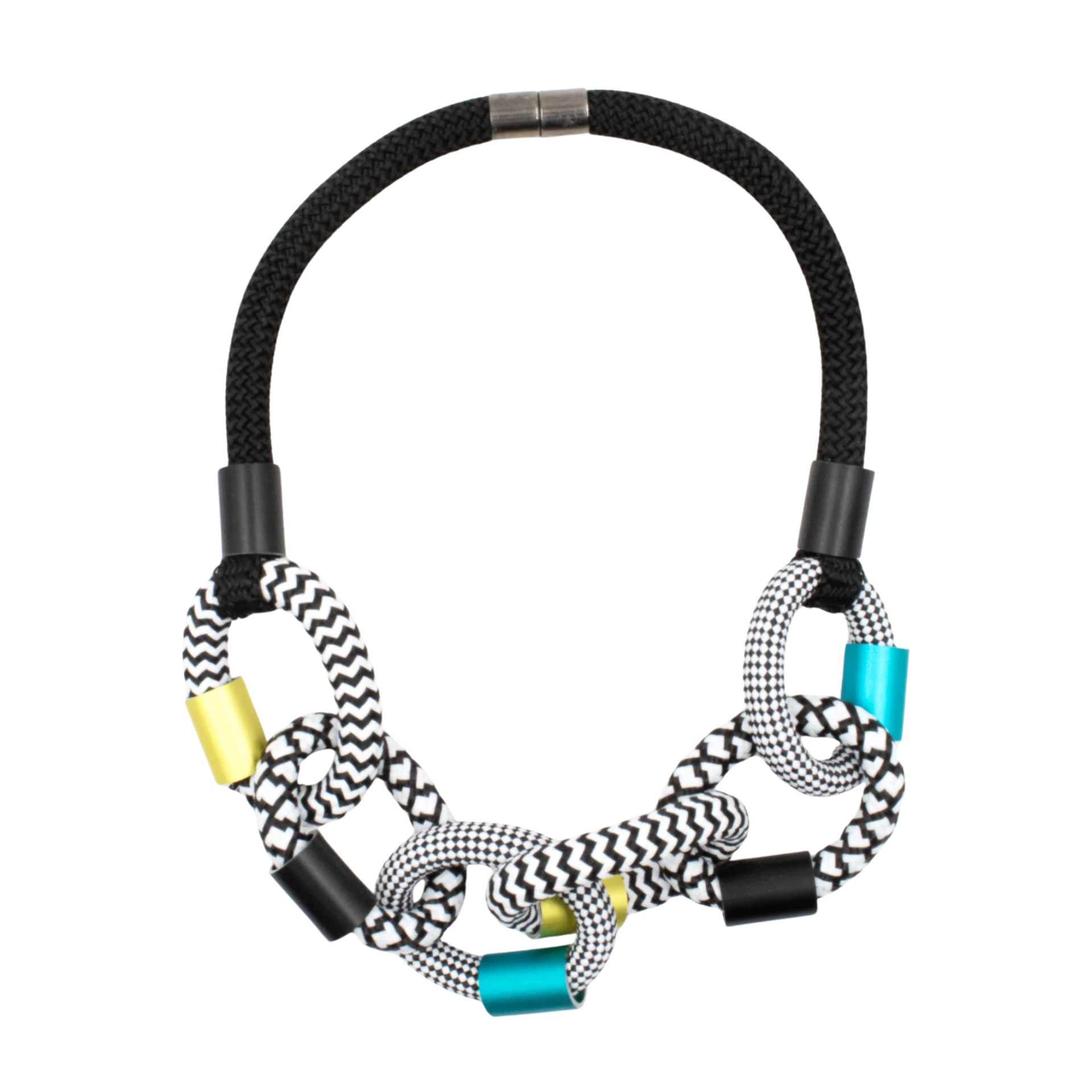 A multi-strand braided rope necklace featuring black and white chevron-patterned cords, black and silver knots, and metallic cylindrical accents in gold and turquoise, displayed on a solid white background.