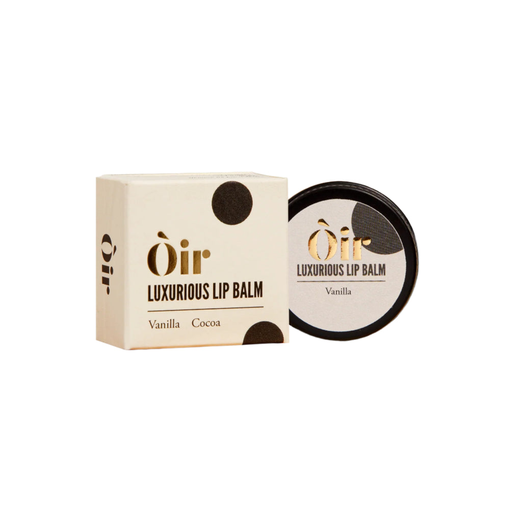 Luxurious lip balm packaging with 'Oir' branding, featuring a vanilla and cocoa themed design, in a metal tin and cardboard box.