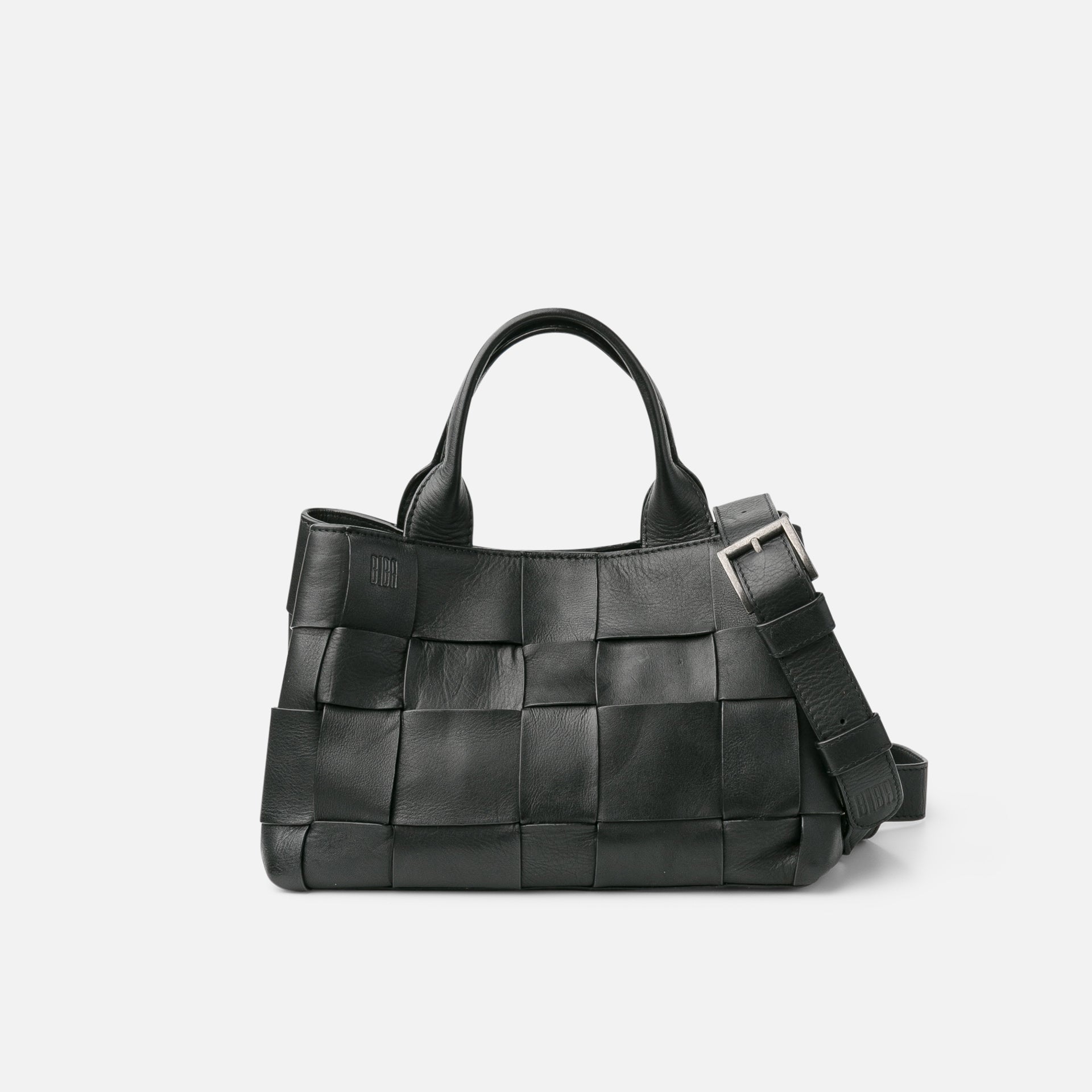 Black woven handbag on a light gray background