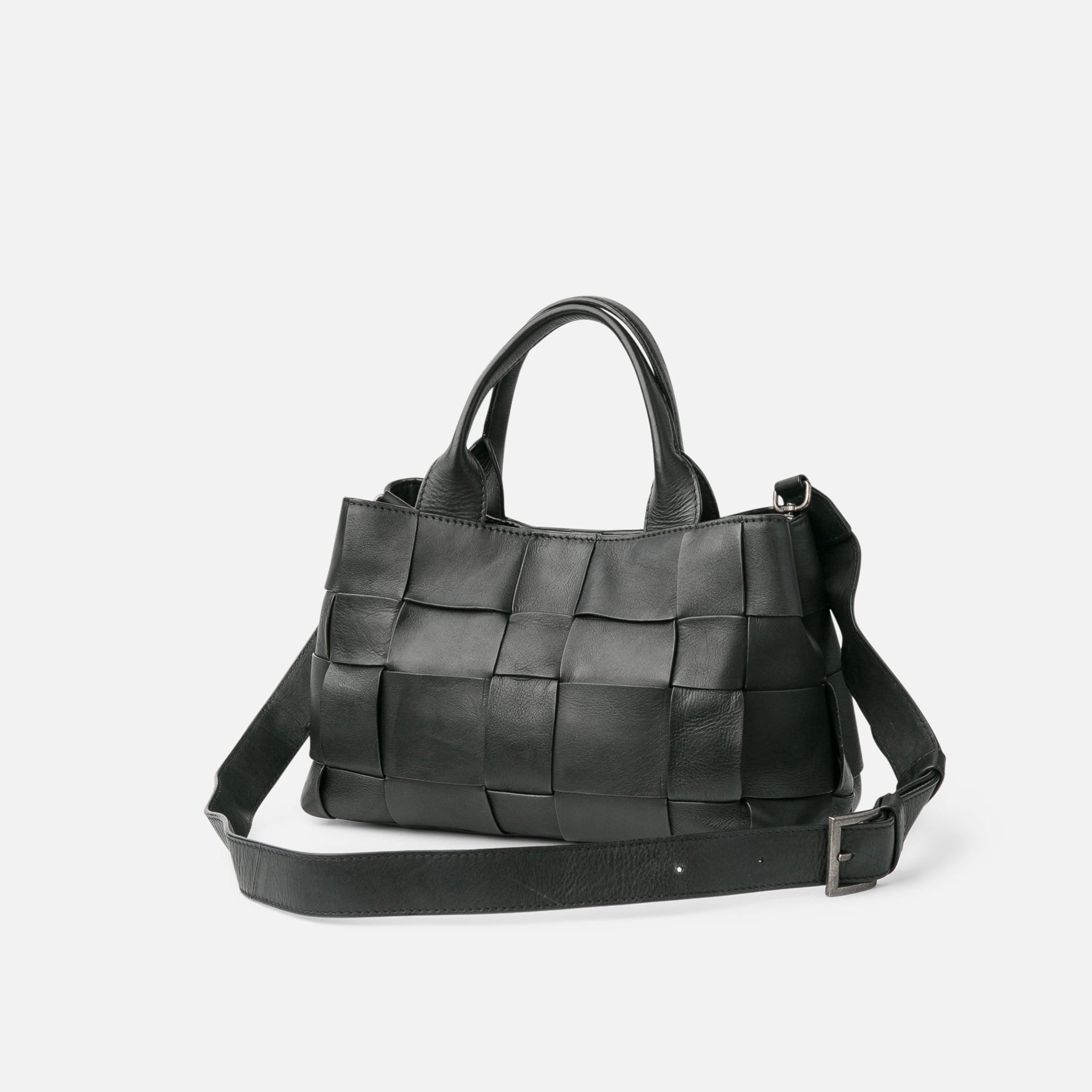 Black woven handbag on a white background