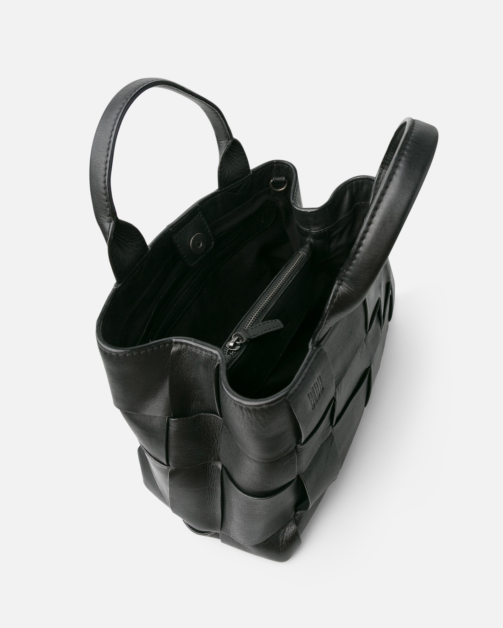 Black leather handbag with a unique design on a white background