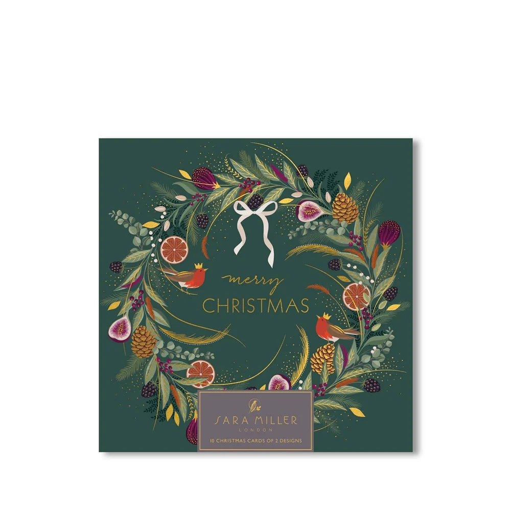 Jara Miller Lovers Merry Christmas card set in a square dark green envelope decorated with a festive floral wreath, gold text, and a gold brand label at the bottom.