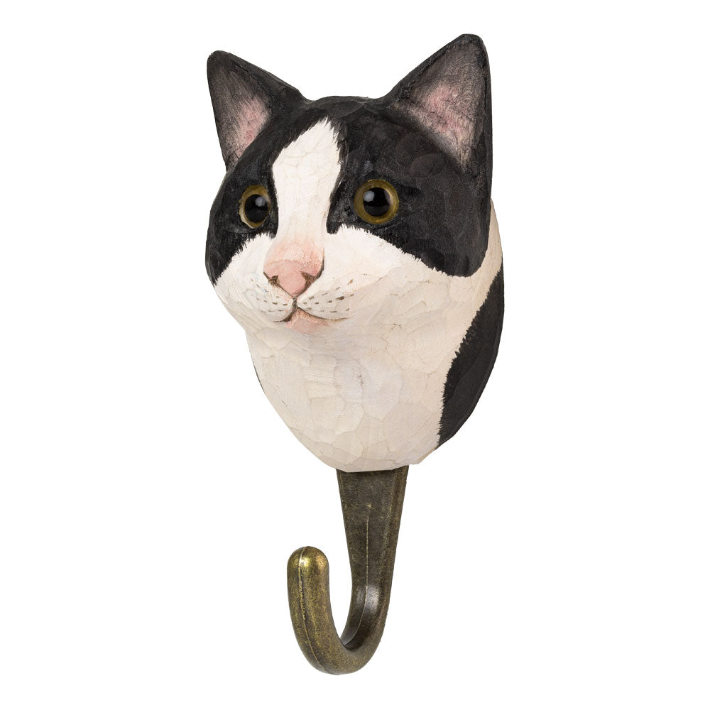 Cat-shaped wall hook with black and white face on a white background