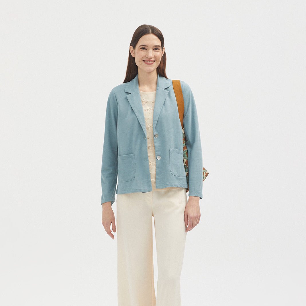 Light blue, cropped, two-pocket blazer with notched lapels and two-button front closure.