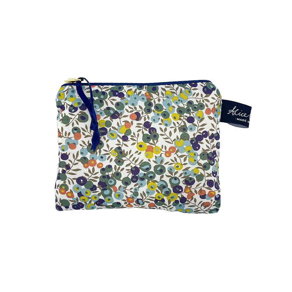 Small zippered pouch with a floral print featuring blue, green, yellow, and orange berries on a white background.