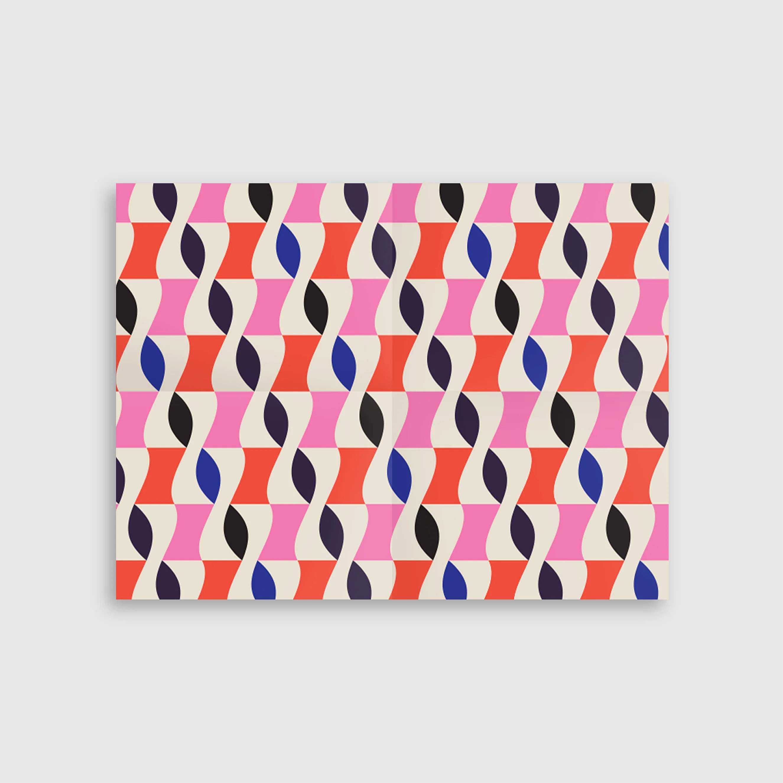 Notebook with a colorful geometric pattern on a white background