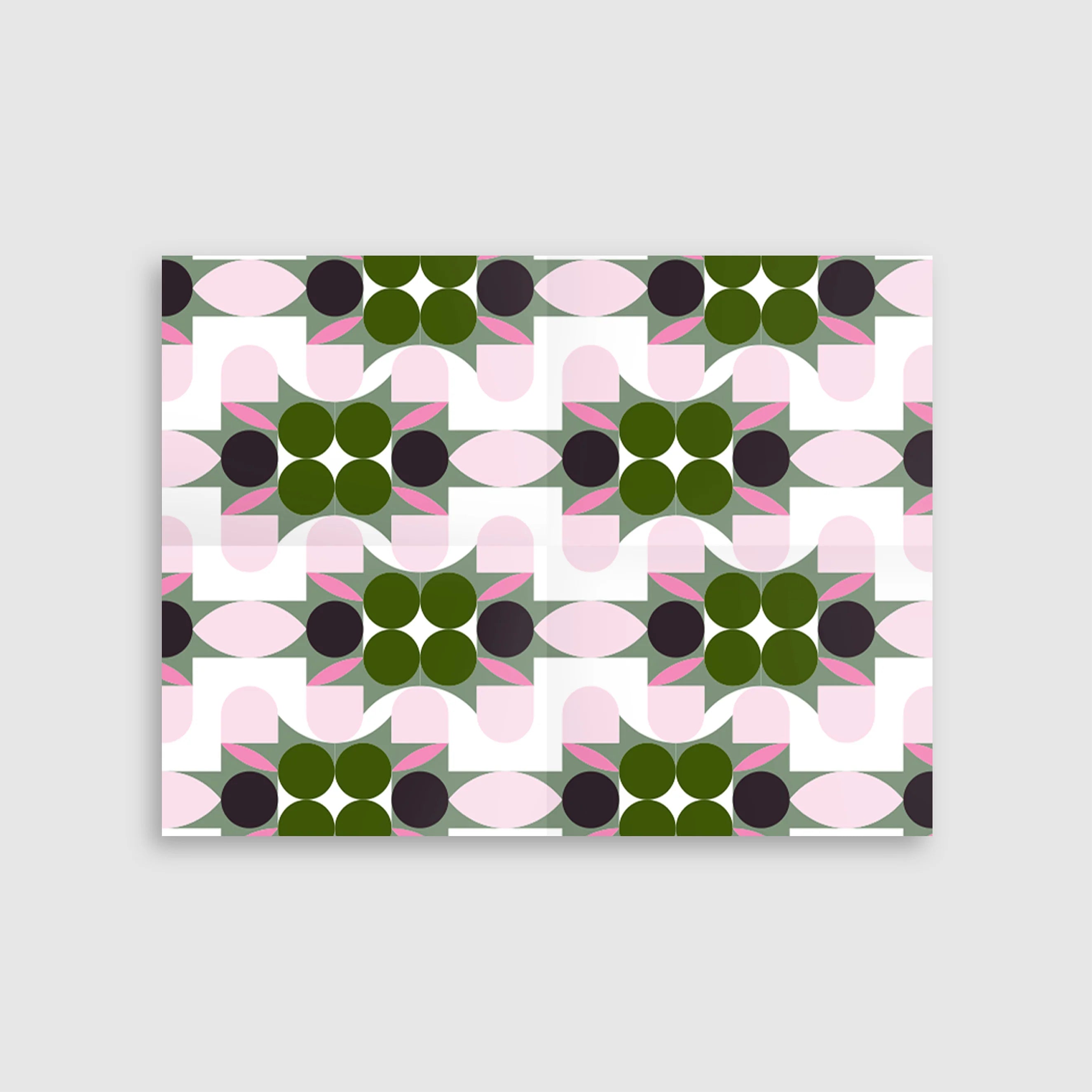 Geometric pattern with green, pink, and black shapes on a white background