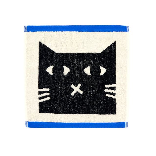 A square white towel or mat featuring a black cat face graphic with white eyes, whiskers, and a small white X on the nose. The top and bottom edges are bordered in bright blue.