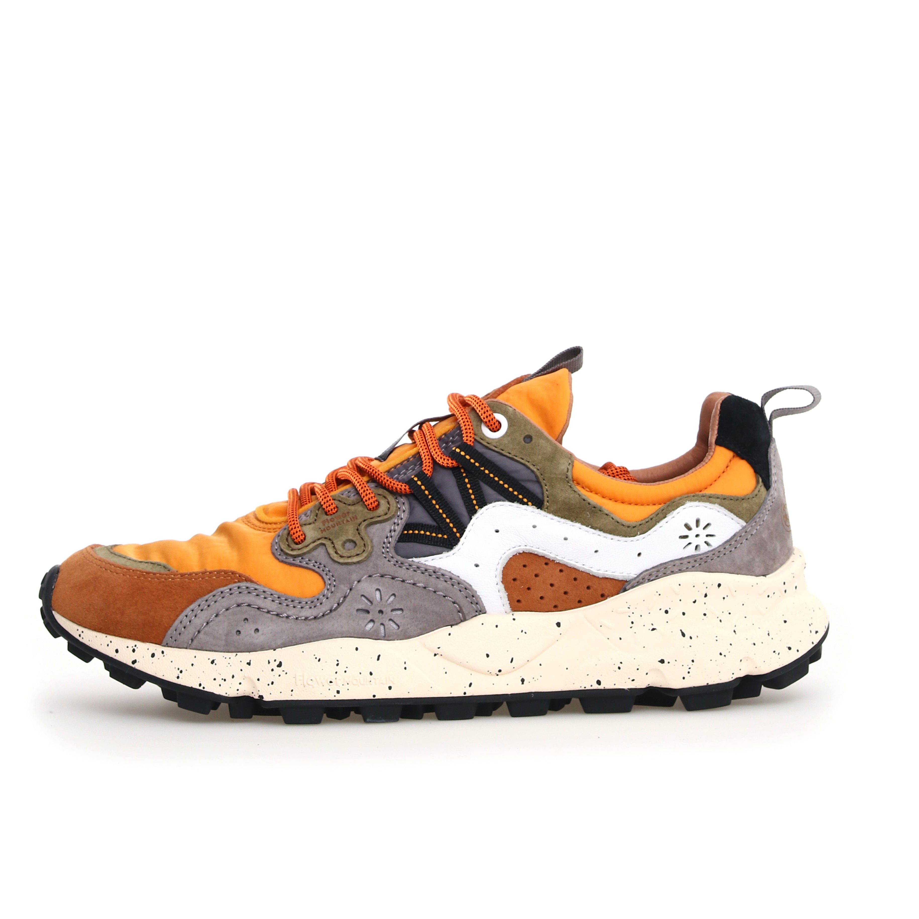 Multi-colored suede and textile sneaker with orange, brown, gray, and white panels.