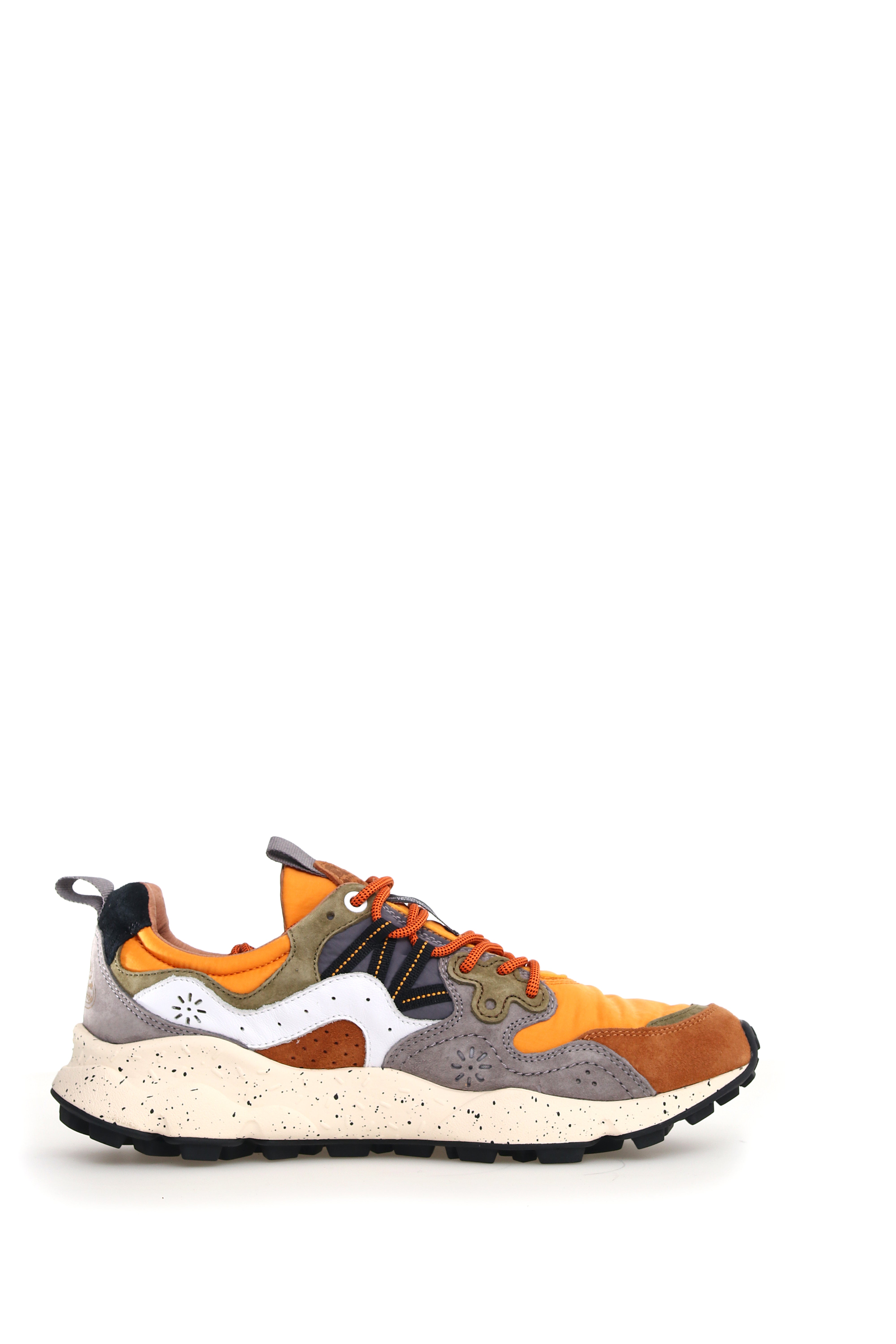 Multicolored low-top sneaker with orange, gray, brown, and olive green suede and nylon panels.