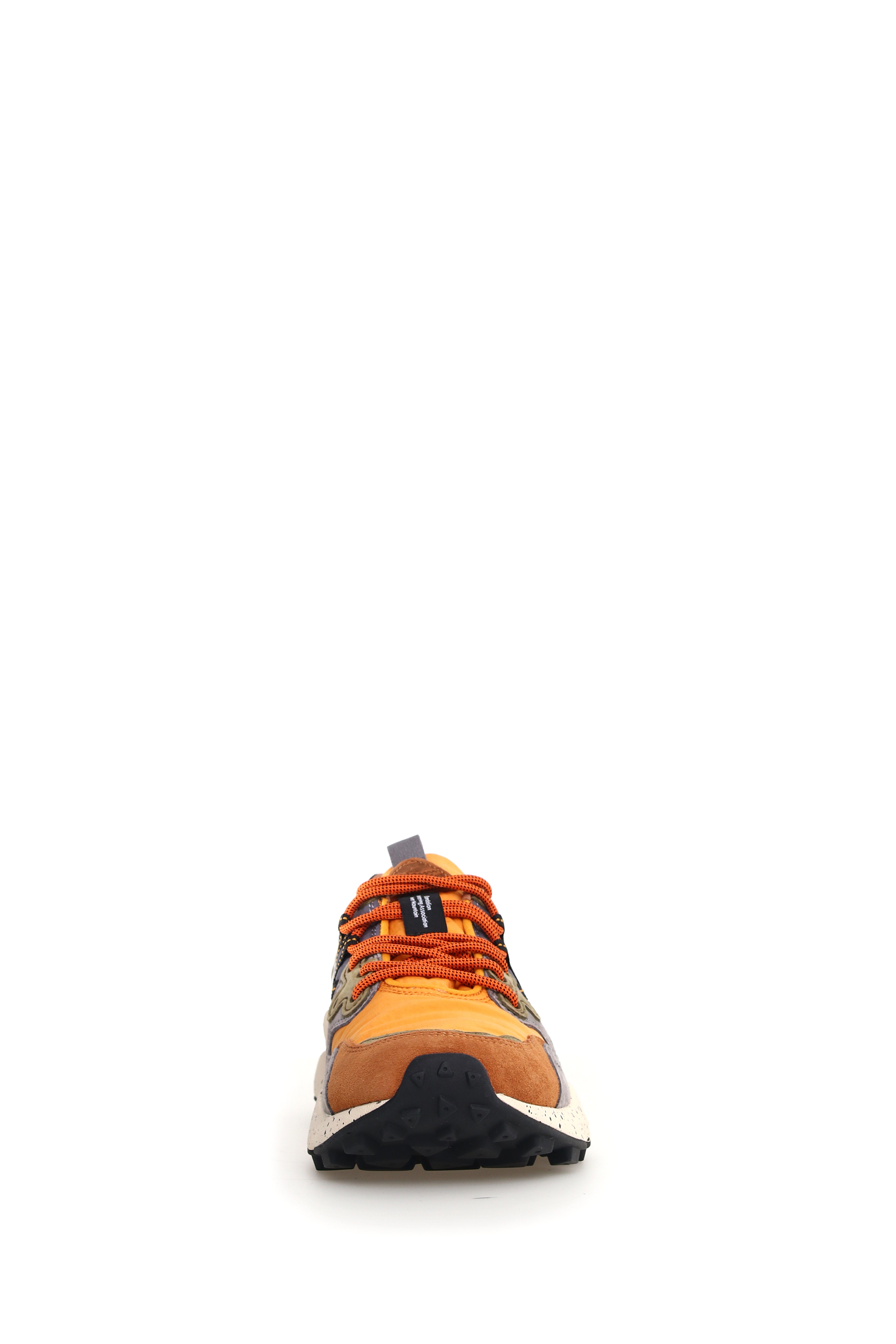 Orange and brown suede and textile sneaker with orange laces and a chunky black sole.