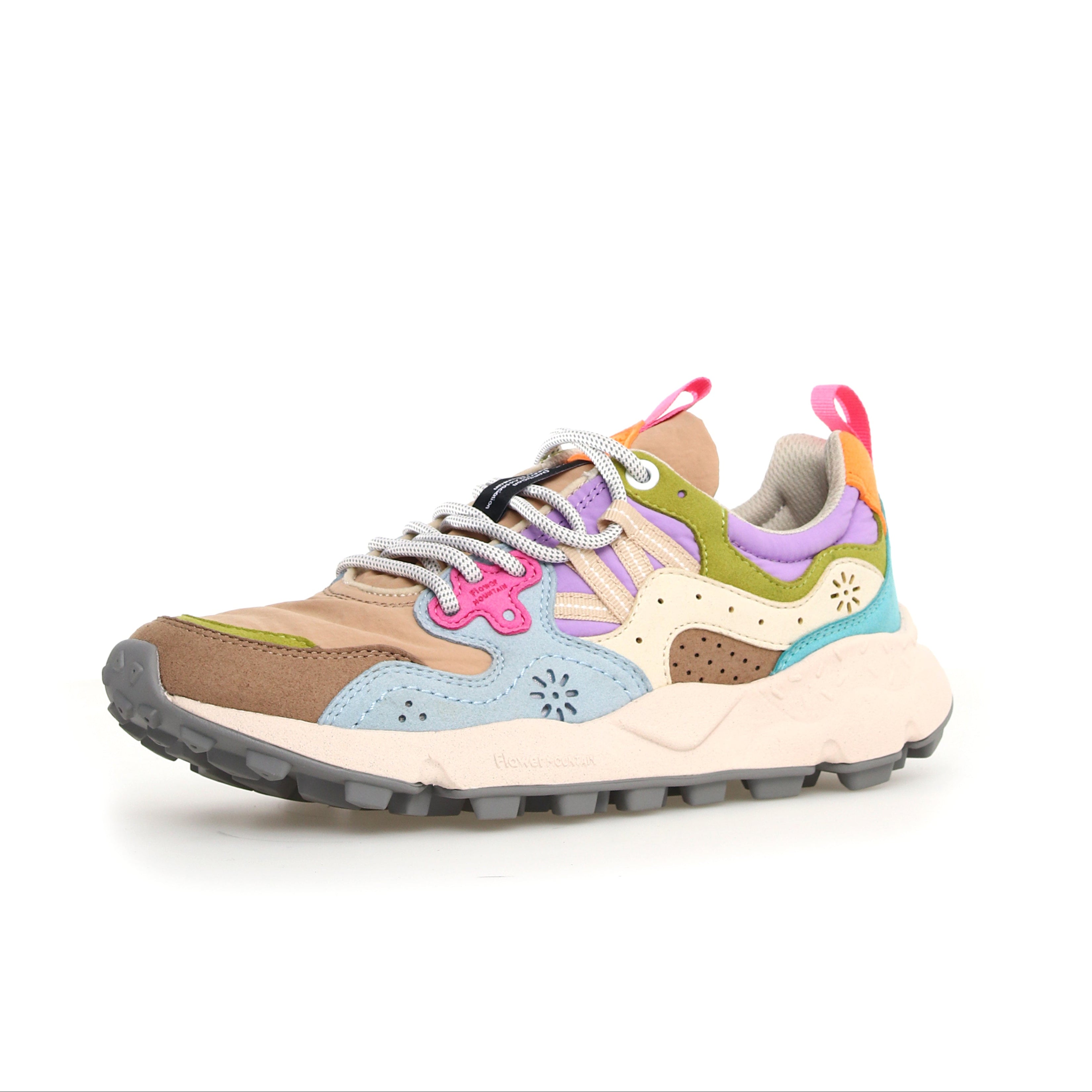 Multicolored low-top sneaker with chunky sole, featuring suede and textile upper in shades of brown, blue, purple, and green.