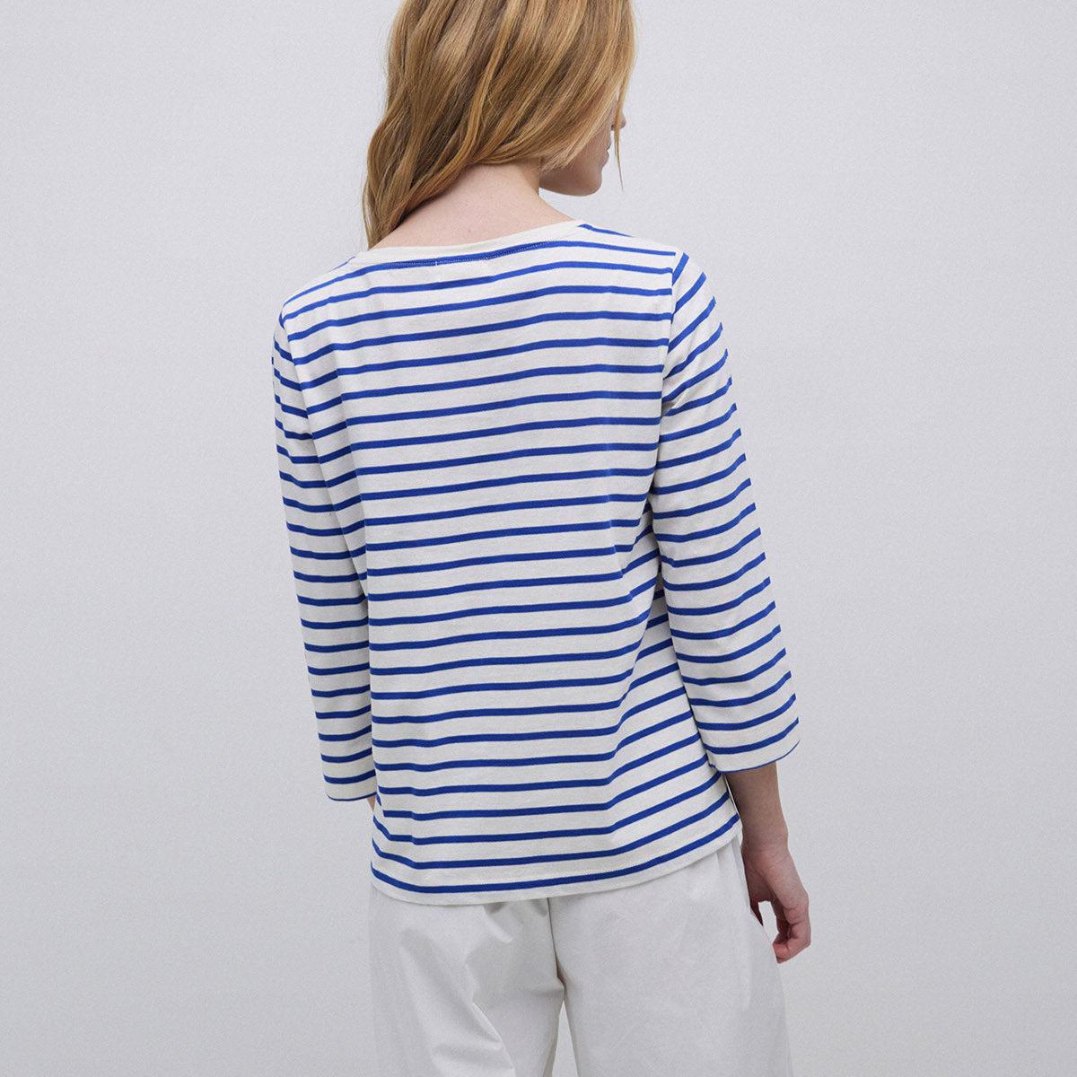 White and blue horizontal striped long-sleeve shirt, viewed from the back.