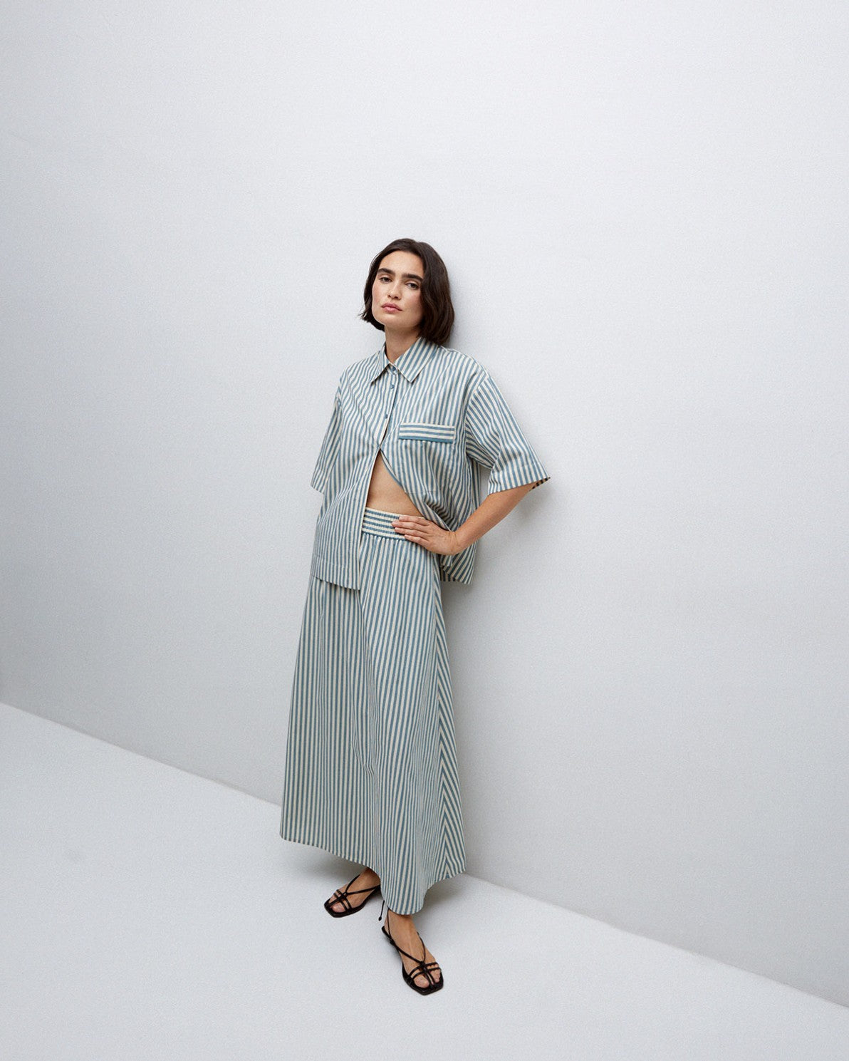 Blue and white striped linen shirt and midi skirt set.  The shirt is short-sleeved and the skirt is A-line.