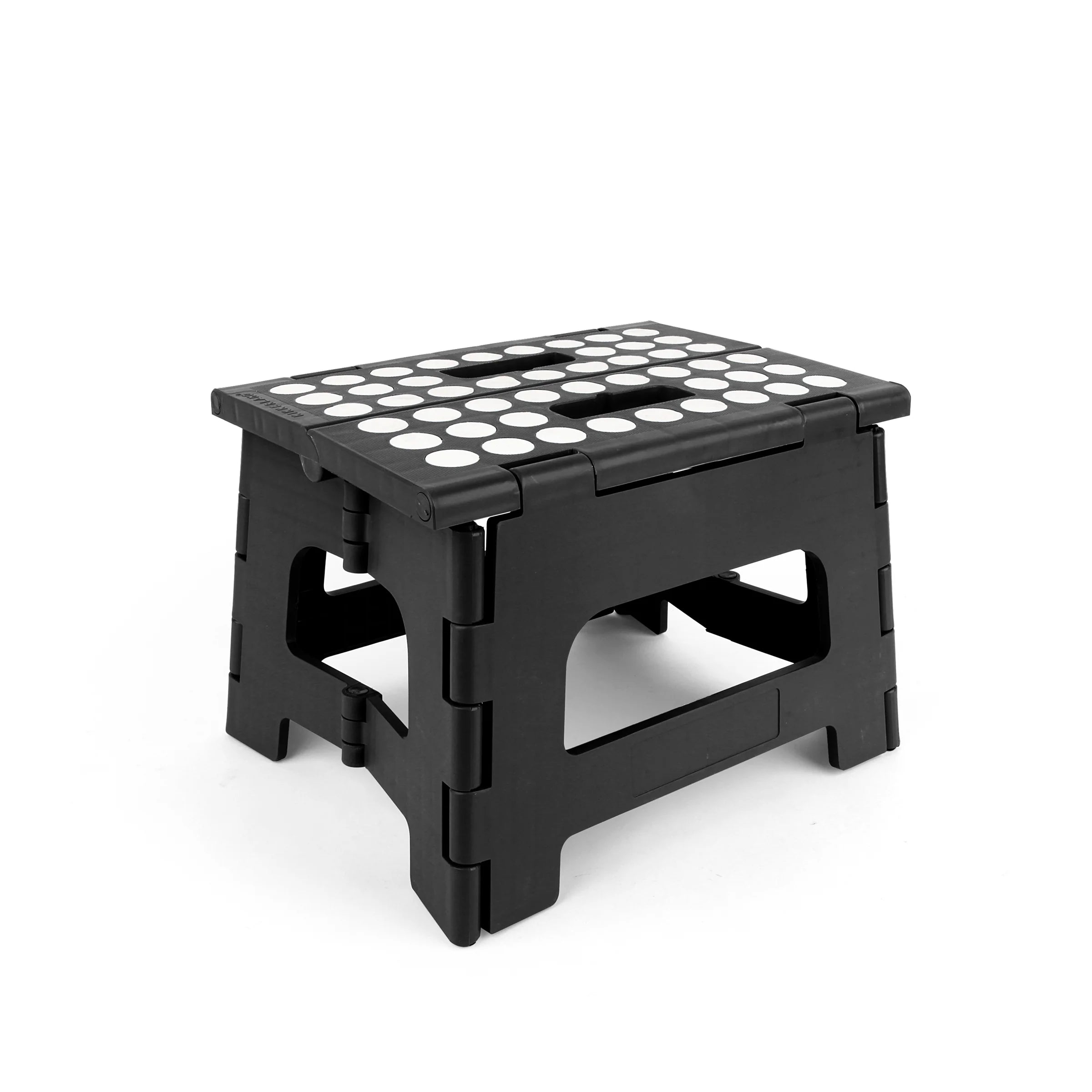 Black plastic folding step stool with white textured top.  The stool is shown from a three-quarter angle.
