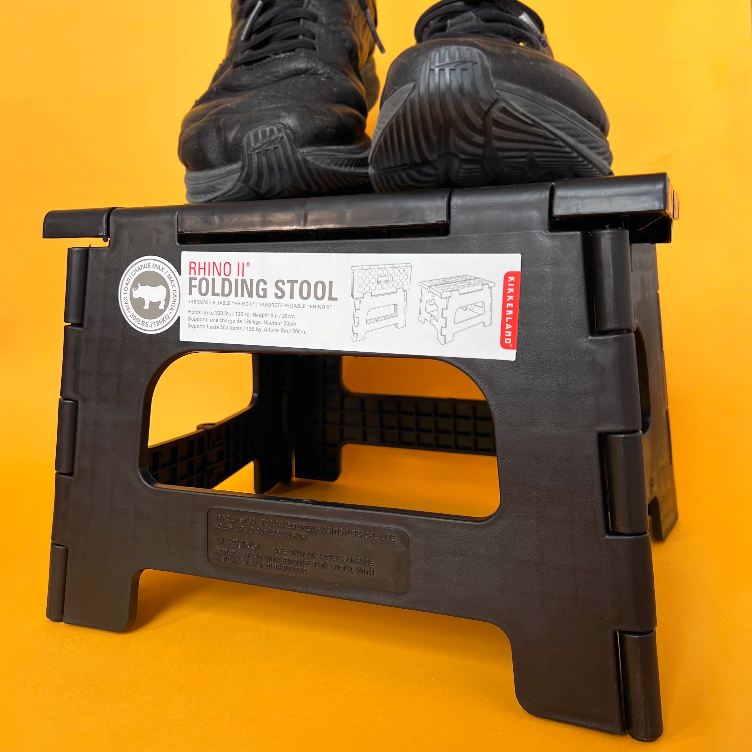 Dark brown Rhino II folding plastic stool; 8 inches high; holds up to 300 lbs.  Kikkerland brand.