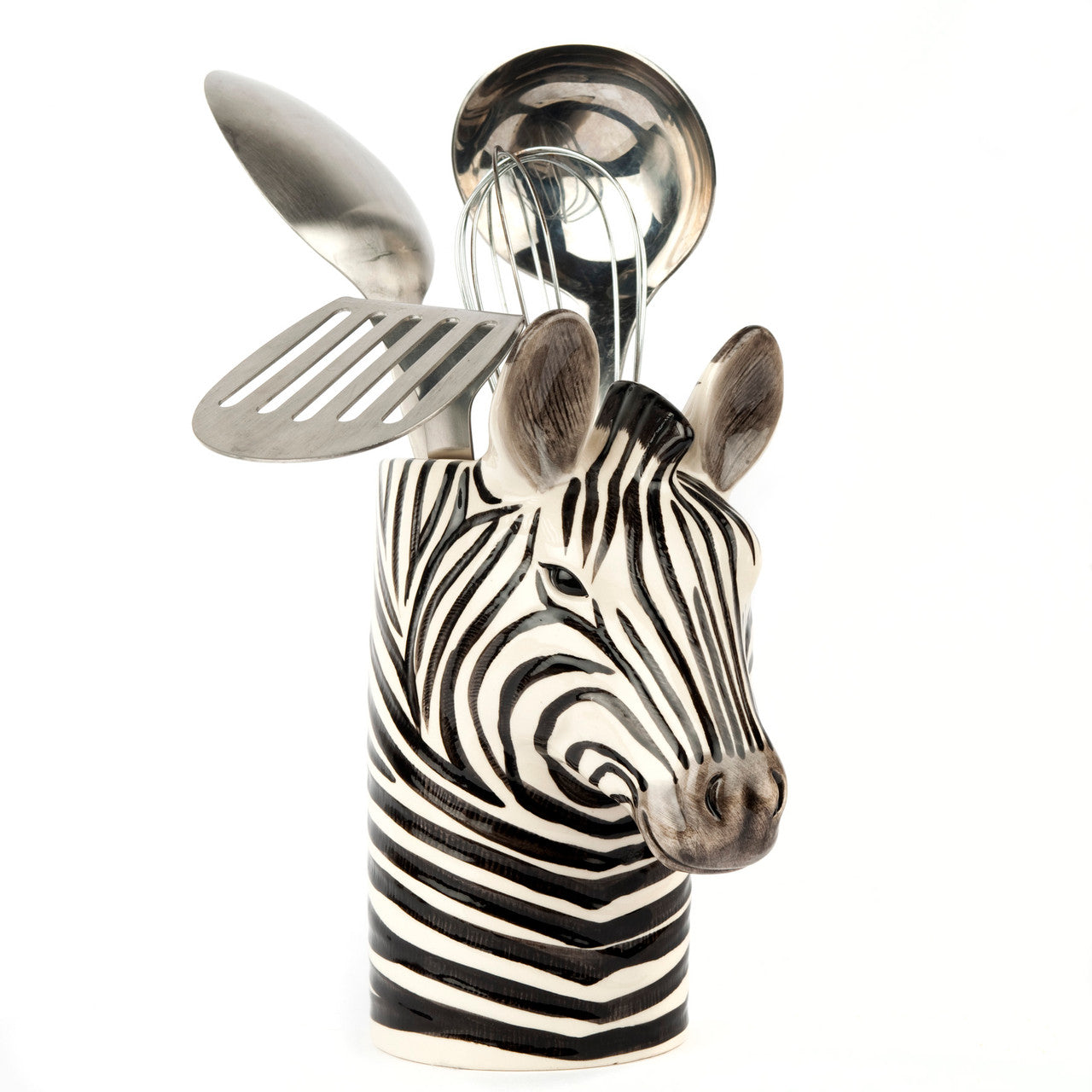 Zebra-shaped utensil holder containing a spoon, spatula, whisk, and ladle.