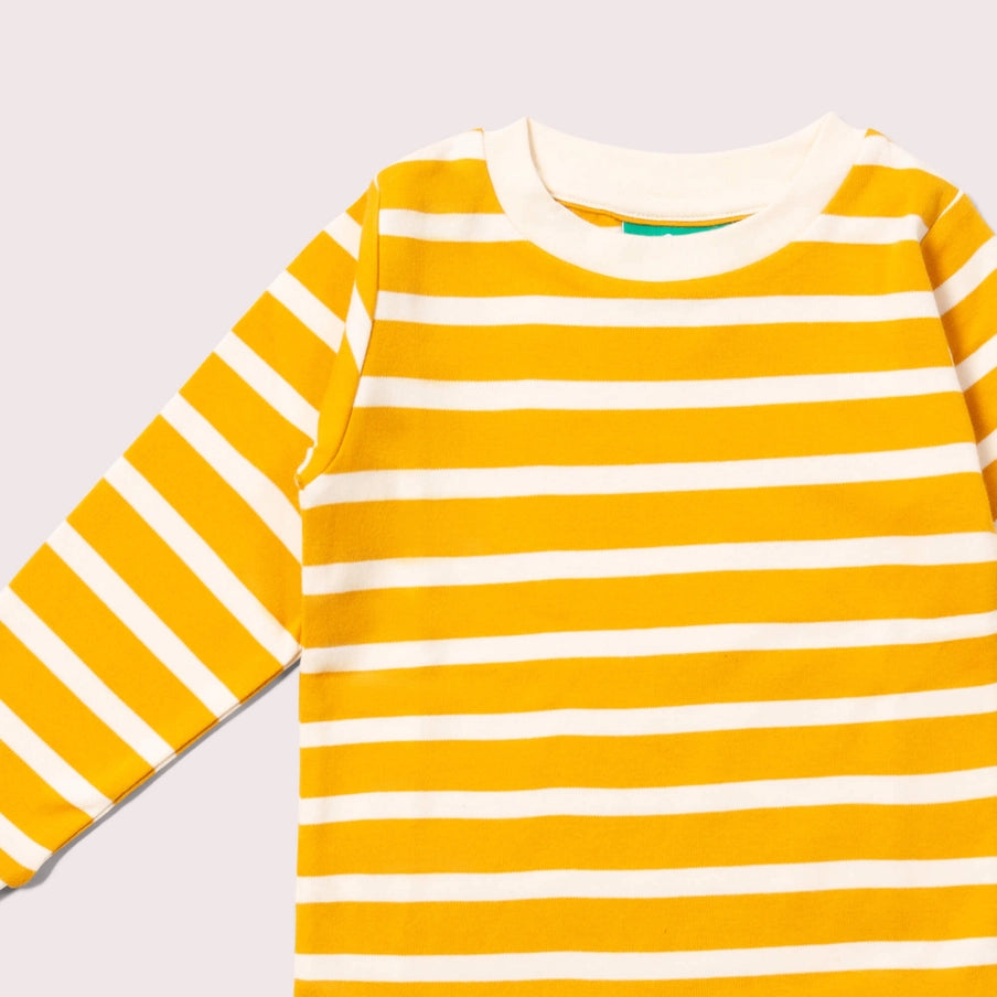 Yellow and white striped long-sleeve shirt on a light gray background