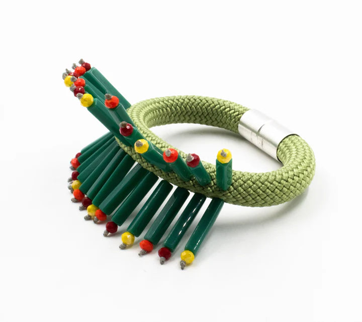 Green rope bracelet adorned with dark green rectangular beads and small red, yellow, and orange accents.