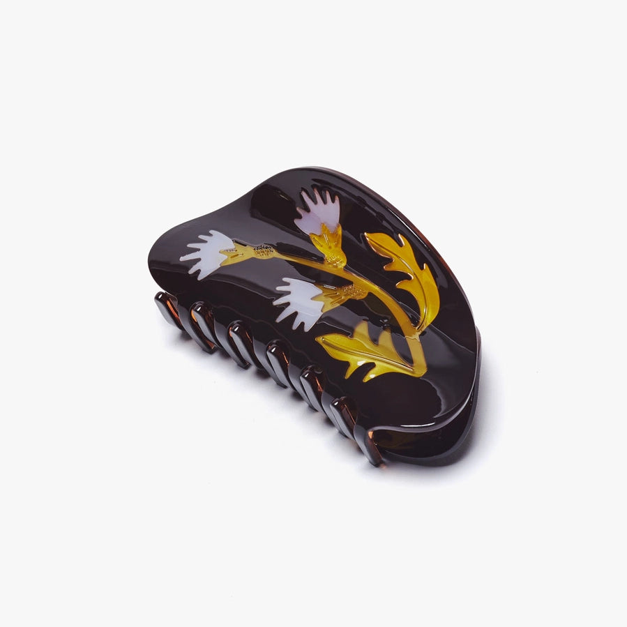 Decorative hair comb with floral design on a white background