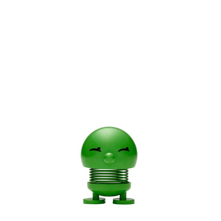 Green bobblehead toy on a spring, with a smiling face.