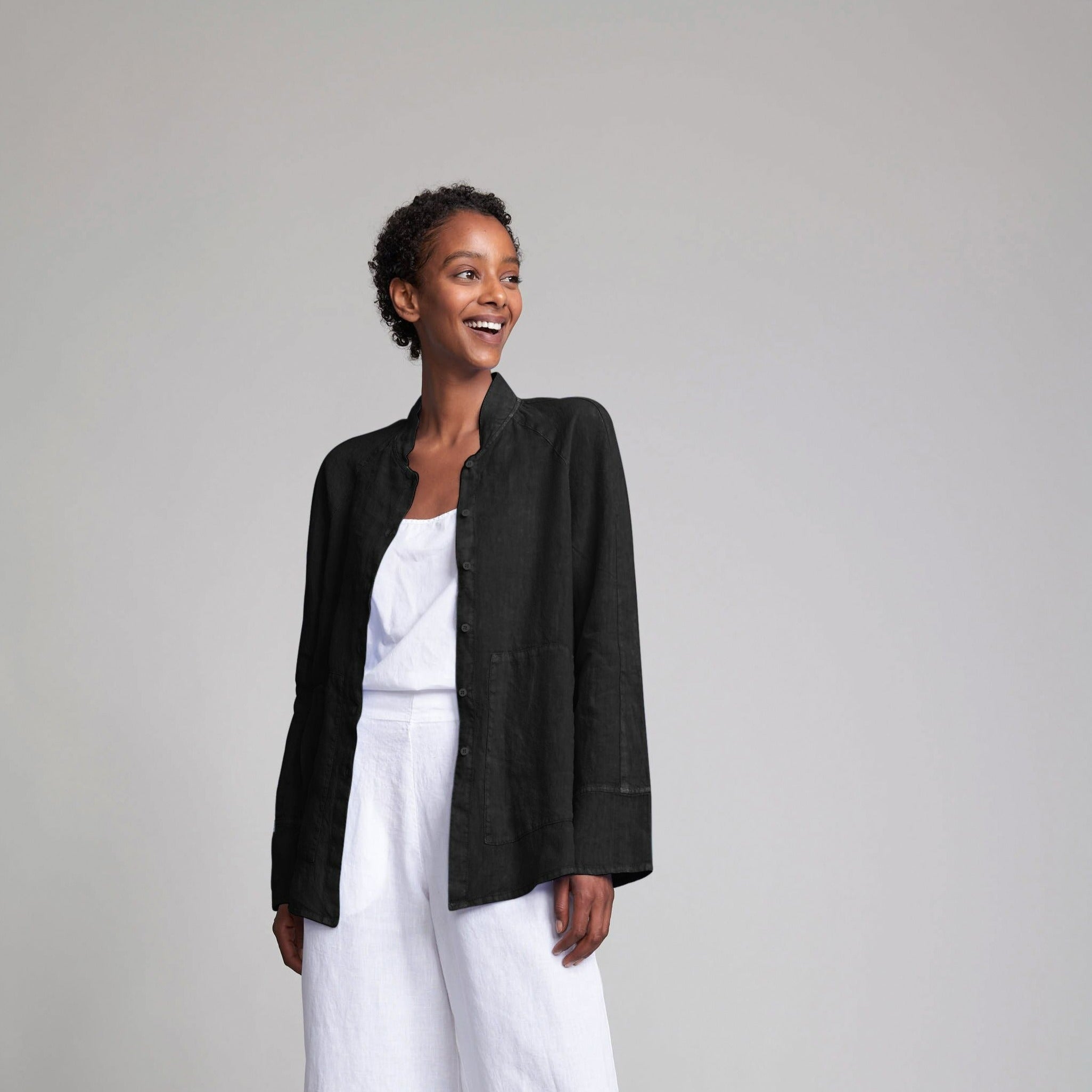 Black linen button-up jacket with long sleeves and a mandarin collar.