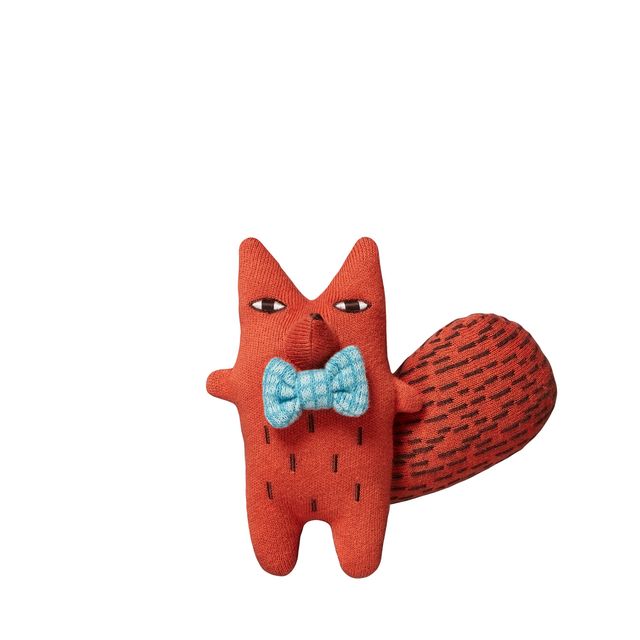 A plush red fox toy with embroidered facial features, a light blue patterned bow tie, and a textured red tail, shown on a plain white background.