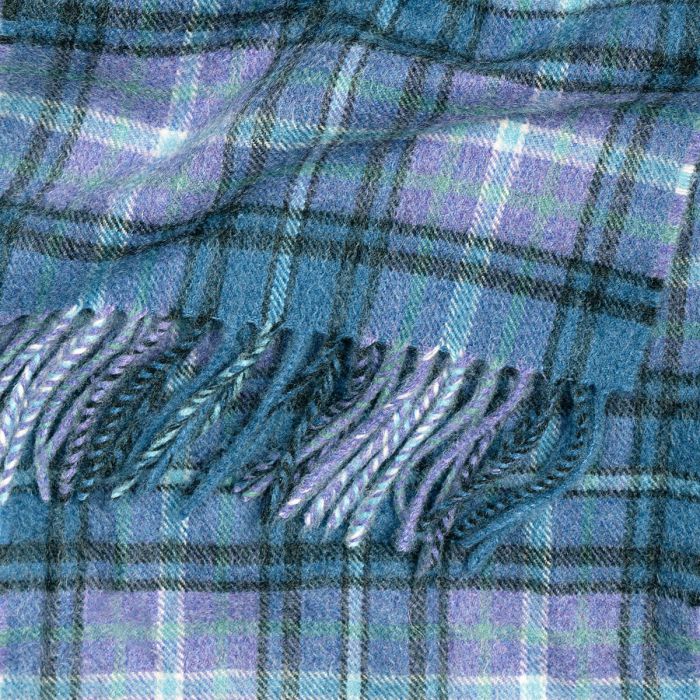 Blue and purple plaid wool throw blanket with fringed edges.