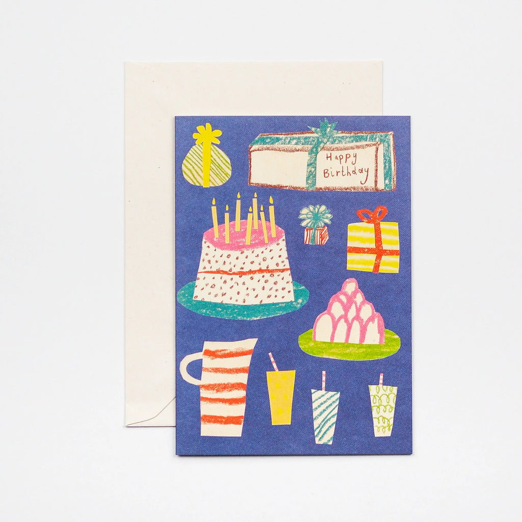 Birthday card featuring a blue background with illustrations of a cake, presents, and drinks.