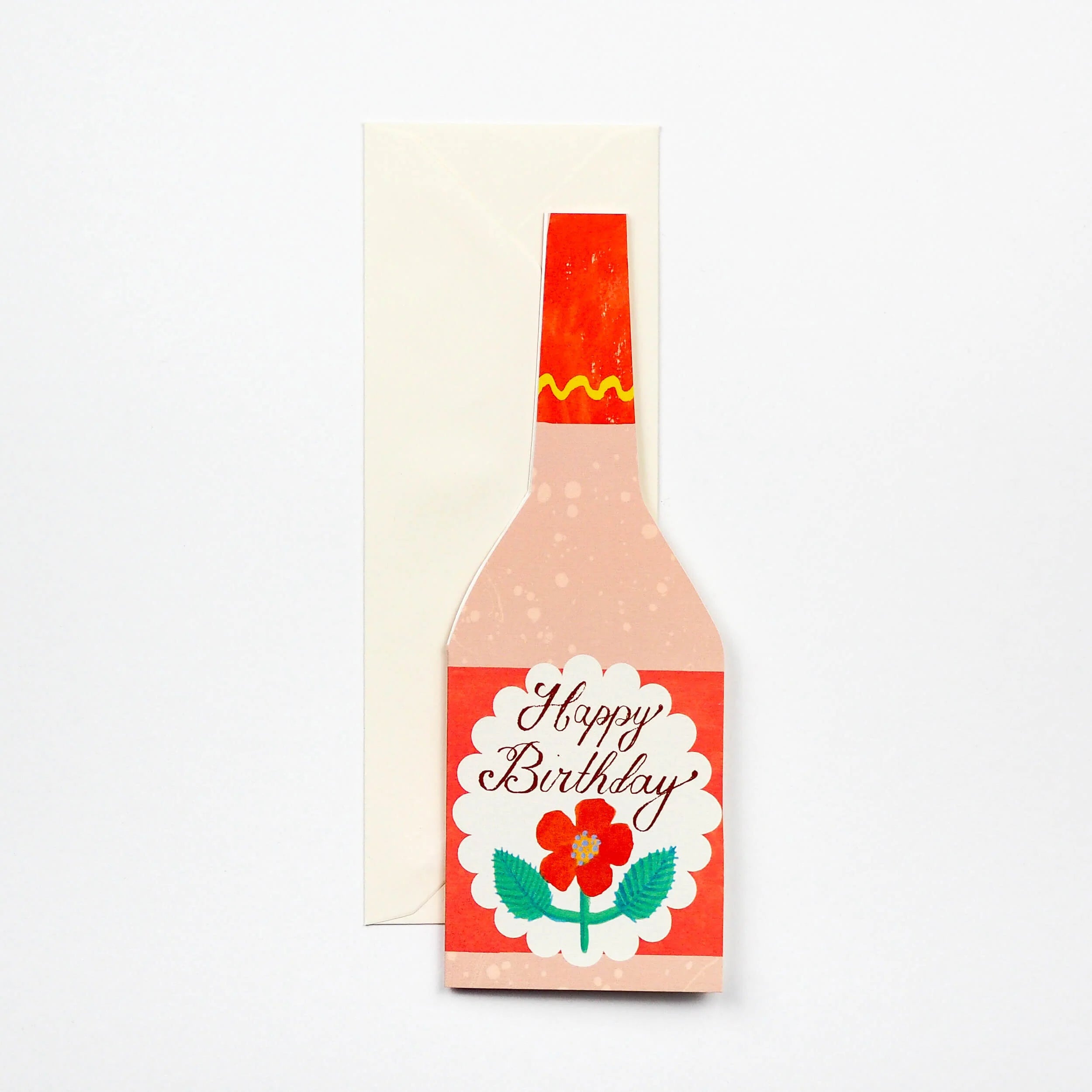 Happy Birthday greeting card shaped like a pink and orange bottle with a red flower illustration.