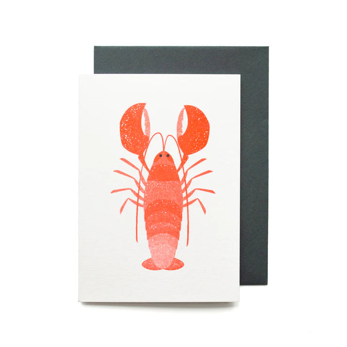 Red lobster illustration on a greeting card with a dark gray envelope.