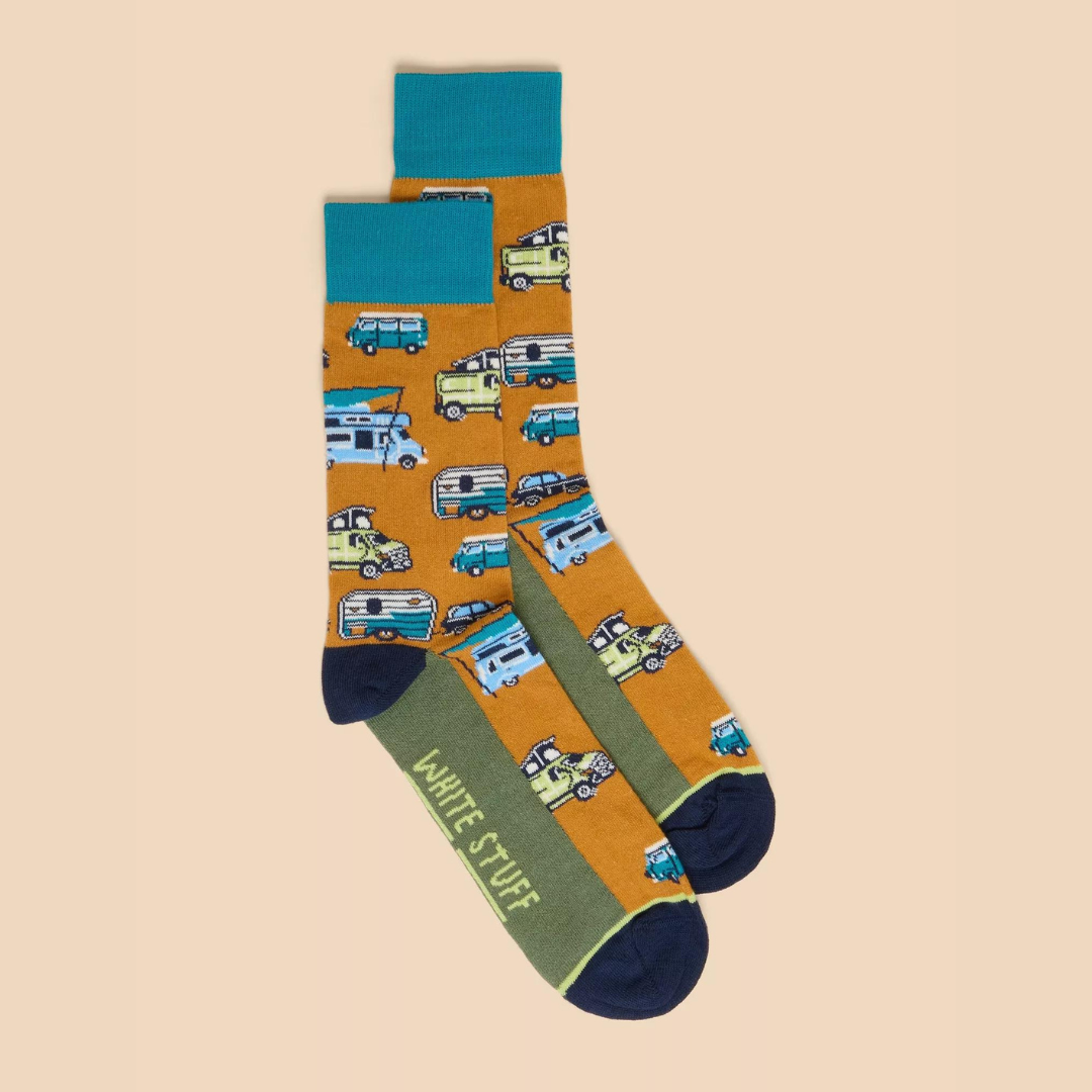 Pair of mustard-colored socks featuring a repeating pattern of vintage camper vans and cars.