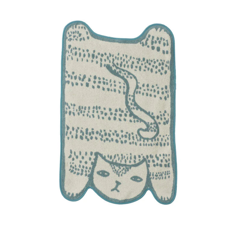 A light cream rug featuring a whimsical cat design in teal, by Donna Wilson.